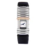 CARTIER - a lady's Declaration wrist watch. Bi-metal factory diamond set case with sliding rings.