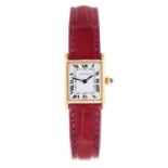 CARTIER - a lady's Tank wrist watch. 18ct yellow gold case. Numbered 671170428. Signed manual wind
