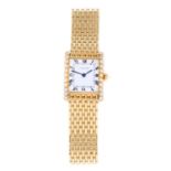CARTIER - a lady's Tank Louis bracelet watch. 18ct yellow gold diamond set case with engraved case
