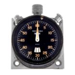 An open face Monte-Carlo dashboard timer by Heuer. Stainless steel case with calibrated bezel.