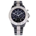 CHANEL - a J12 chronograph bracelet watch. Black ceramic case with stainless steel factory tapered