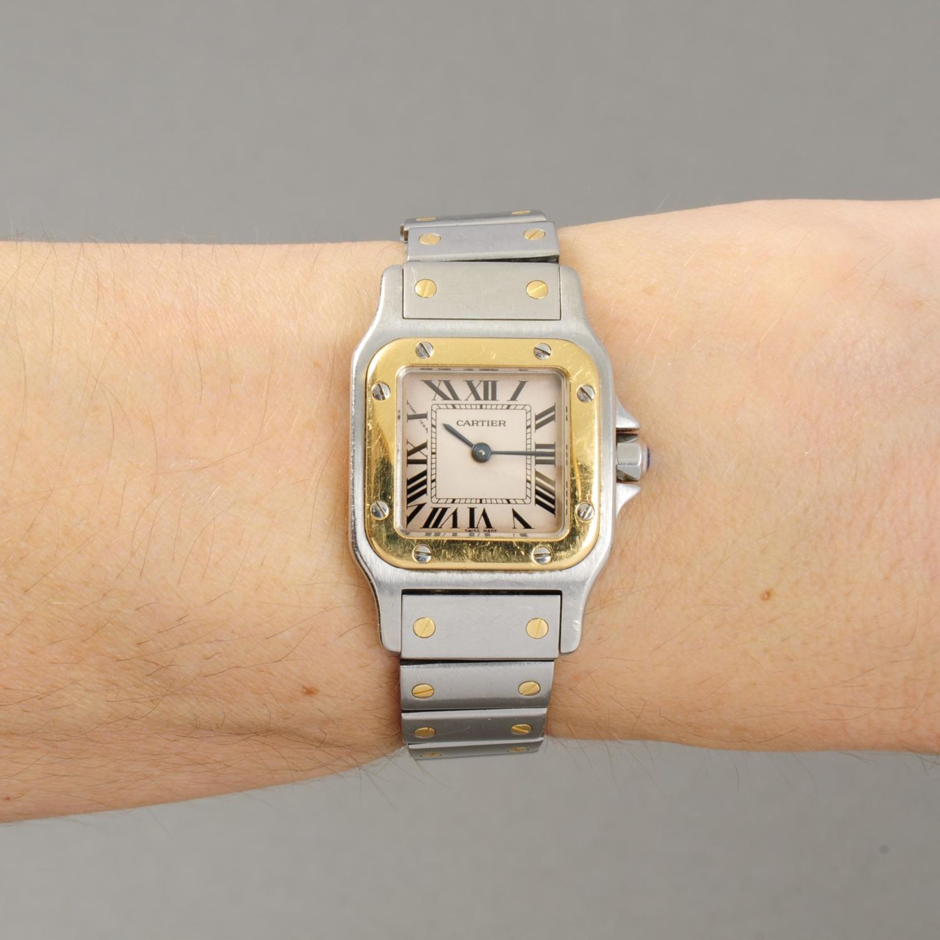CARTIER - a lady's Santos bracelet watch. Stainless steel case with yellow metal bezel. Reference - Image 3 of 7