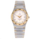 OMEGA - a gentleman's Constellation bracelet watch. Stainless steel case with yellow metal chapter