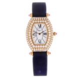 CHOPARD - a lady's wrist watch. 18ct yellow gold case with factory diamond set bezel. Numbered