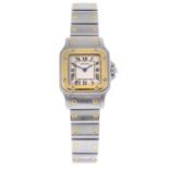 CARTIER - a lady's Santos bracelet watch. Stainless steel case with yellow metal bezel. Reference
