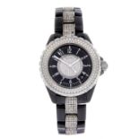 CHANEL - a J12 bracelet watch. Ceramic case with stainless steel factory diamond set bezel and