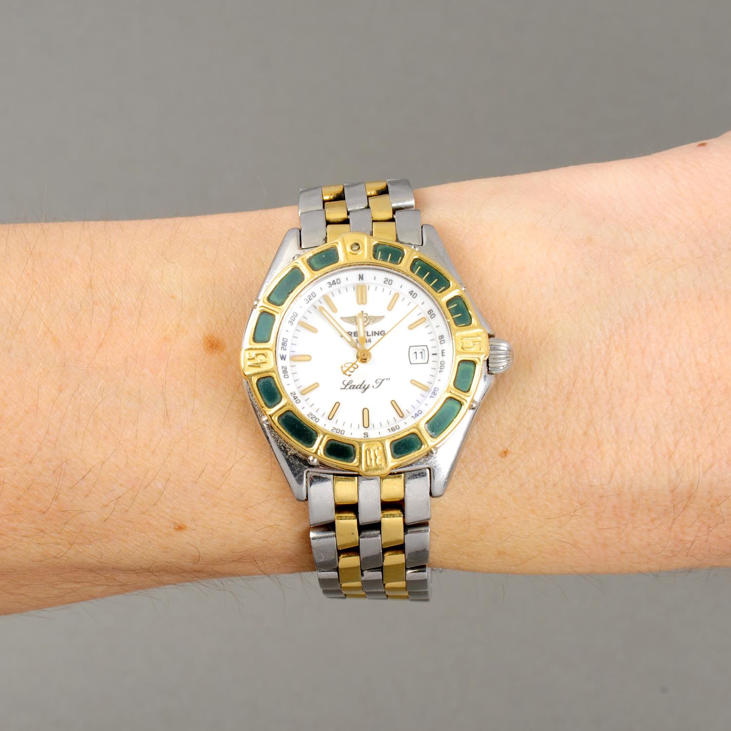BREITLING - a lady's Lady J bracelet watch. Stainless steel case with yellow metal calibrated bezel. - Image 3 of 5