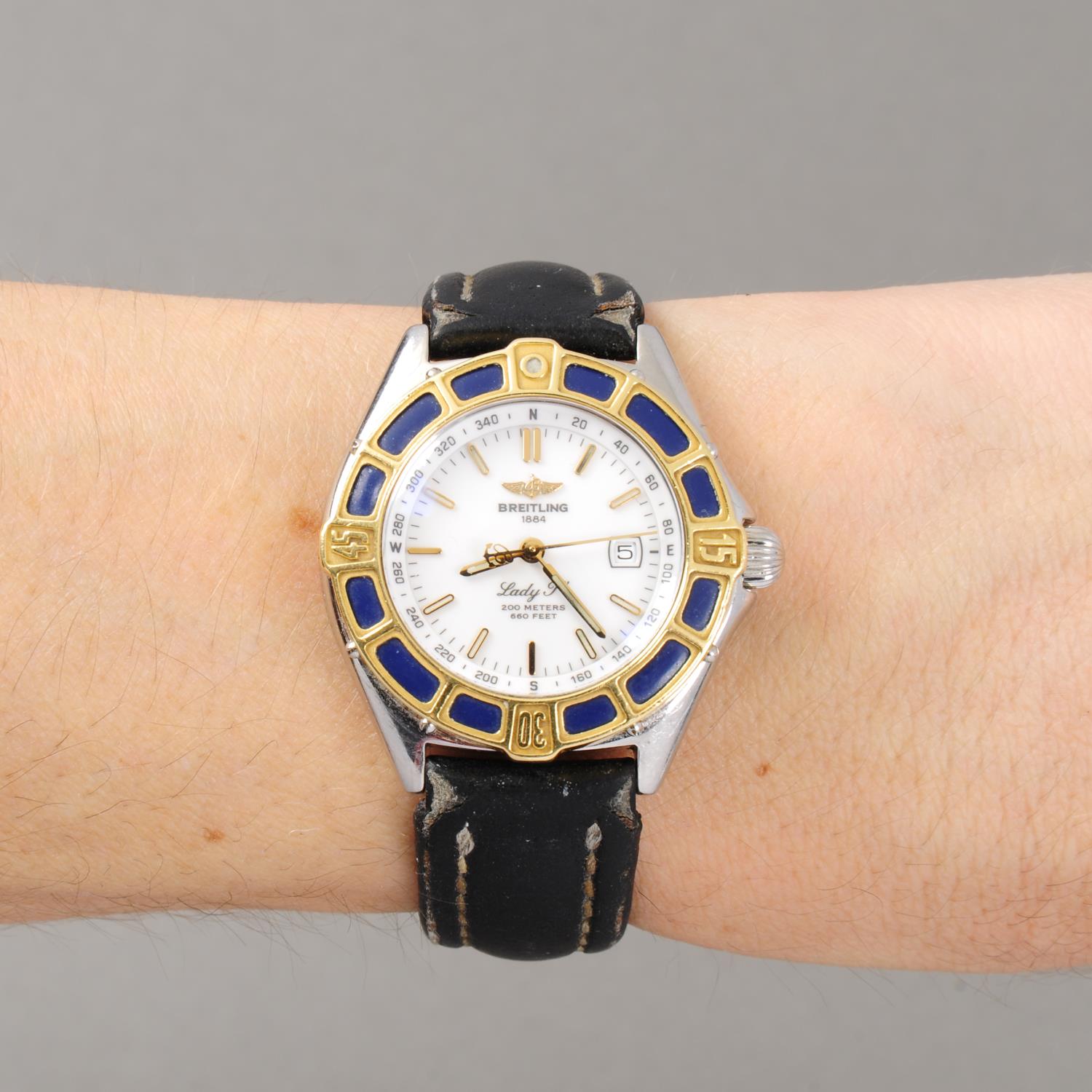 BREITLING - a lady's Lady J wrist watch. Stainless steel case with yellow metal calibrated bezel. - Image 3 of 5