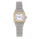 CARTIER - a lady's Santos bracelet watch. Stainless steel case with yellow metal bezel. Numbered