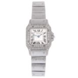 CARTIER - a lady's Santos bracelet watch. Stainless steel diamond set case with diamond set bezel.