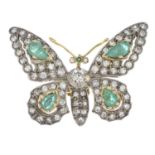 An emerald and diamond butterfly brooch.