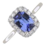 A sapphire and diamond cluster ring.Sapphire weight 0.91ct,