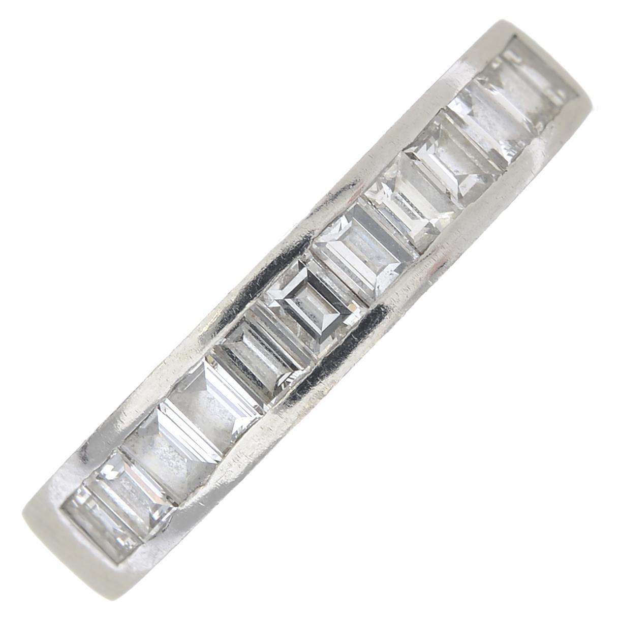 A platinum diamond half eternity ring.Estimated total diamond weight 0.85ct,