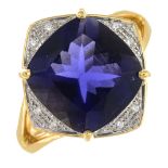 An 18ct gold diamond and iolite ring.Calculated iolite weight 5.40cts,