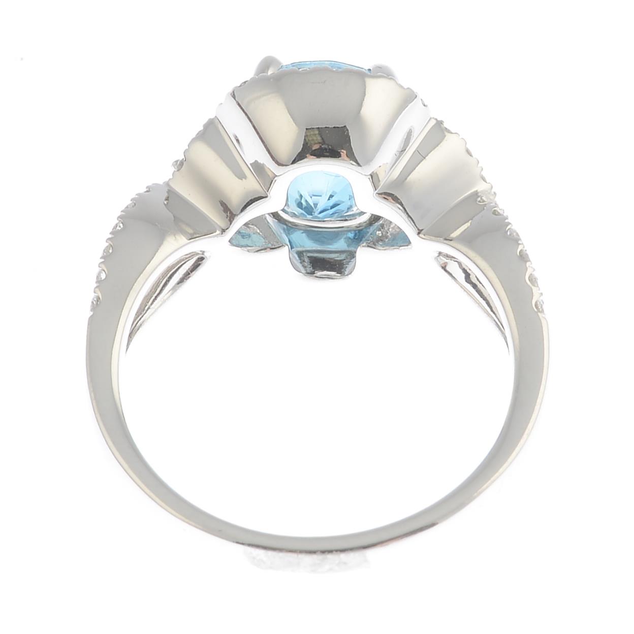 A blue zircon and diamond dress ring.Zircon calculated weight 3.5cts, - Image 2 of 3