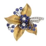 A sapphire and diamond foliate brooch.