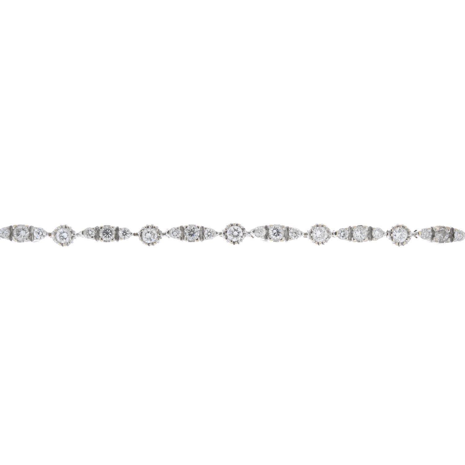 An 18ct gold diamond line bracelet.