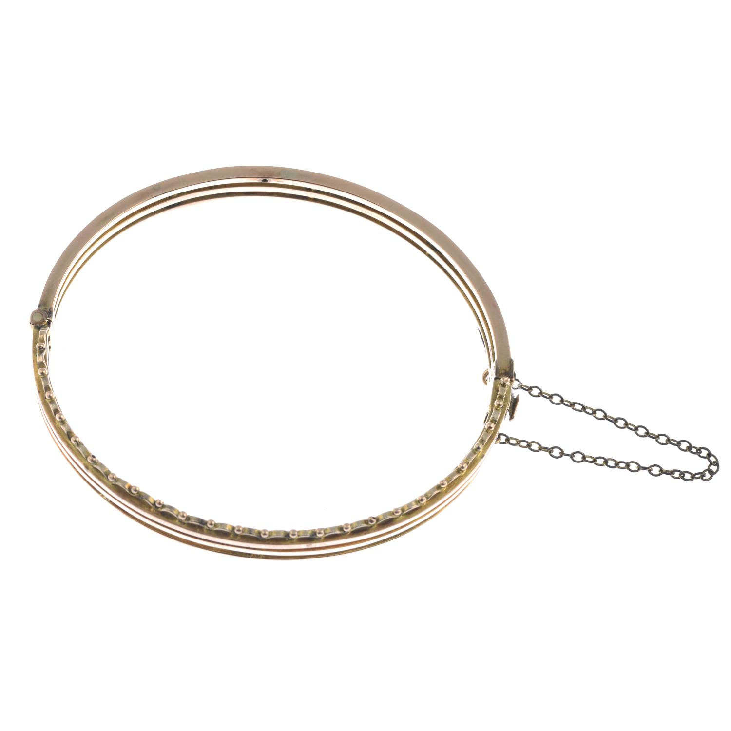 A hinged bangle with scalloped edging.Stamped 9ct. - Image 2 of 2
