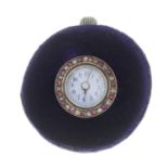 An early 20th century ruby and diamond button hole watch.Diameter 1.4cms.