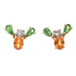 A pair of 18ct gold garnet and diamond earrings.Estimated total diamond weight 0.30ct.Hallmarks for