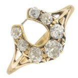 A late Victorian 18ct gold old-cut diamond horseshoe ring.Estimated total diamond weight 0.60ct,