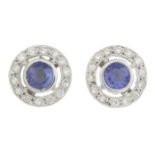 A pair of sapphire and diamond cluster earrings.Estimated total diamond weight 0.20ct.Stamped