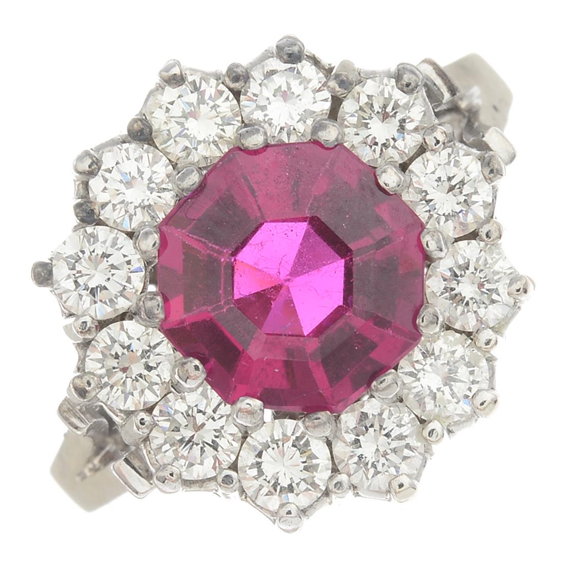 A synthetic ruby and diamond cluster ring.Estimated total diamond weight 1.20cts,