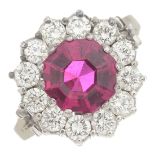 A synthetic ruby and diamond cluster ring.Estimated total diamond weight 1.20cts,
