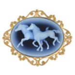 An agate cameo brooch, depicting two horses.