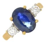 An 18ct gold sapphire and diamond three stone ring.Calculated sapphire weight 2.50cts,