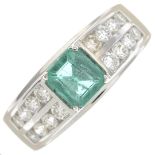 An emerald and diamond dress ring.Estimated total diamond weight 0.70ct,