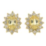 A pair of 18ct yellow sapphire and diamond cluster earrings.Estimated total diamond weight