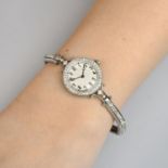 A lady's mid 20th century platinum and 14ct gold diamond cocktail watch,