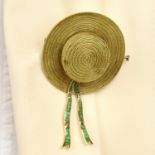 An emerald boatman's hat brooch, by Missiaglia.
