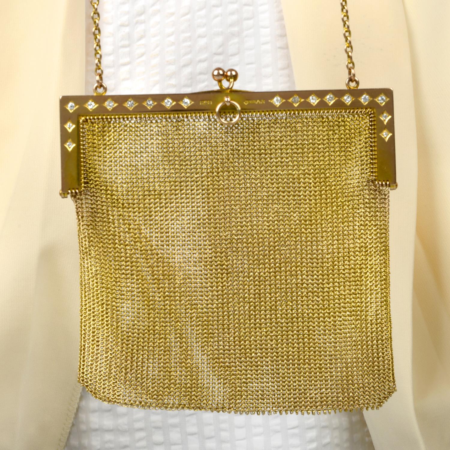 An Edwardian 9ct gold mesh-link purse, with old-cut diamond highlights.