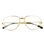 CARTIER - a pair of gold-plated prescription glasses.