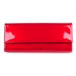 STUART WEITZMAN - red patent clutch.