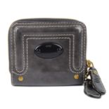 CHLOÉ - a grey patent leather purse.