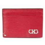 SALVATORE FERRAGAMO - a red leather card holder wallet.