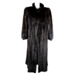 A full-length dark ranch mink coat.