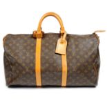 LOUIS VUITTON - a vintage Monogram Keepall 50 luggage bag.