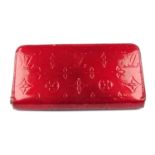 LOUIS VUITTON - a red Monogram Vernis Zippy wallet.