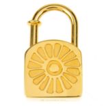 HERMÈS - a Lotus Cadena lock charm.