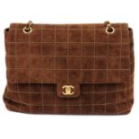 CHANEL - a brown suede handbag.