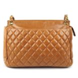 CHANEL - a vintage tan quilted leather handbag.