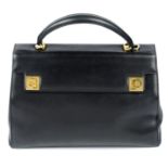 SALVATORE FERRAGAMO - a black leather handbag.