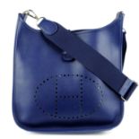 HERMÈS - a 2013 blue Evelyn PM handbag.