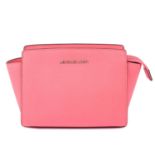 MICHAEL KORS - a pink Selma handbag.