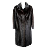 A full-length ranch mink coat.