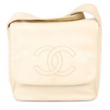 CHANEL - an ivory leather Flap handbag.